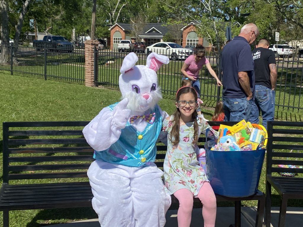 costume bunny and girl sitting on bench