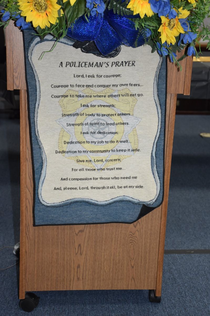 policeman prayer banner with flowers